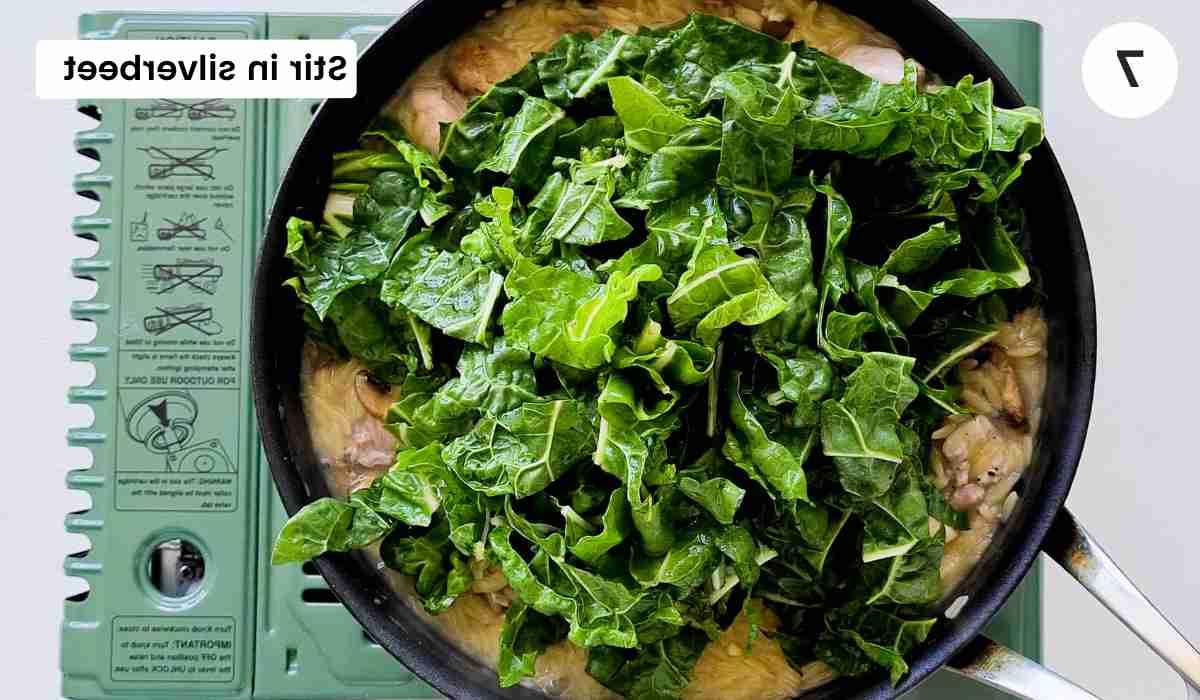 Chopped silverbeet inside a saute pan with caption