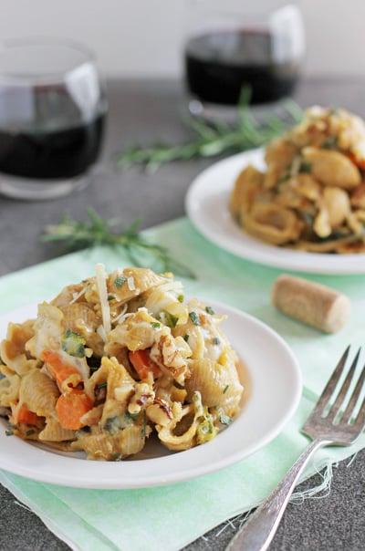 Two white plates filled with servings of Butternut Squash Pasta Skillet.