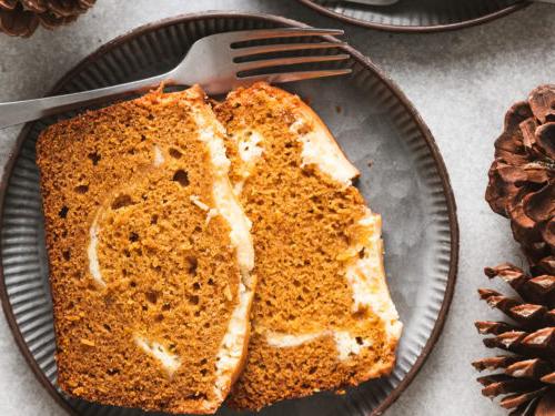 Pumpkin cream cheese bread on a metal plate.