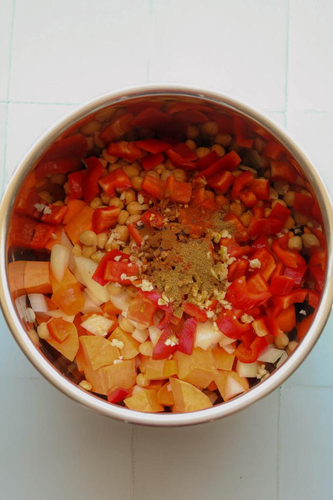 ingredients for spiced sweet potato soup in pressure cooker bowl