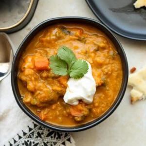 square image of spiced sweet potato spinach soup