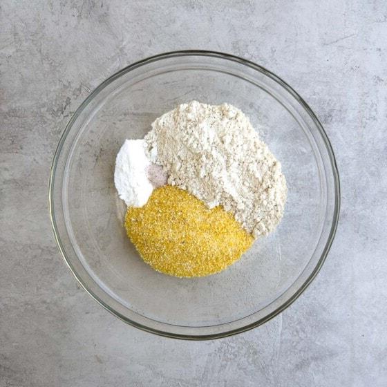 Dry ingredients for the cake in a glass bowl.