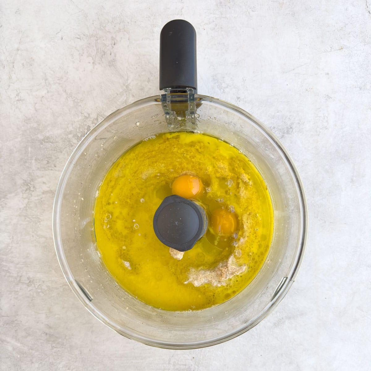 Adding the wet ingredients, eggs and olive oil.